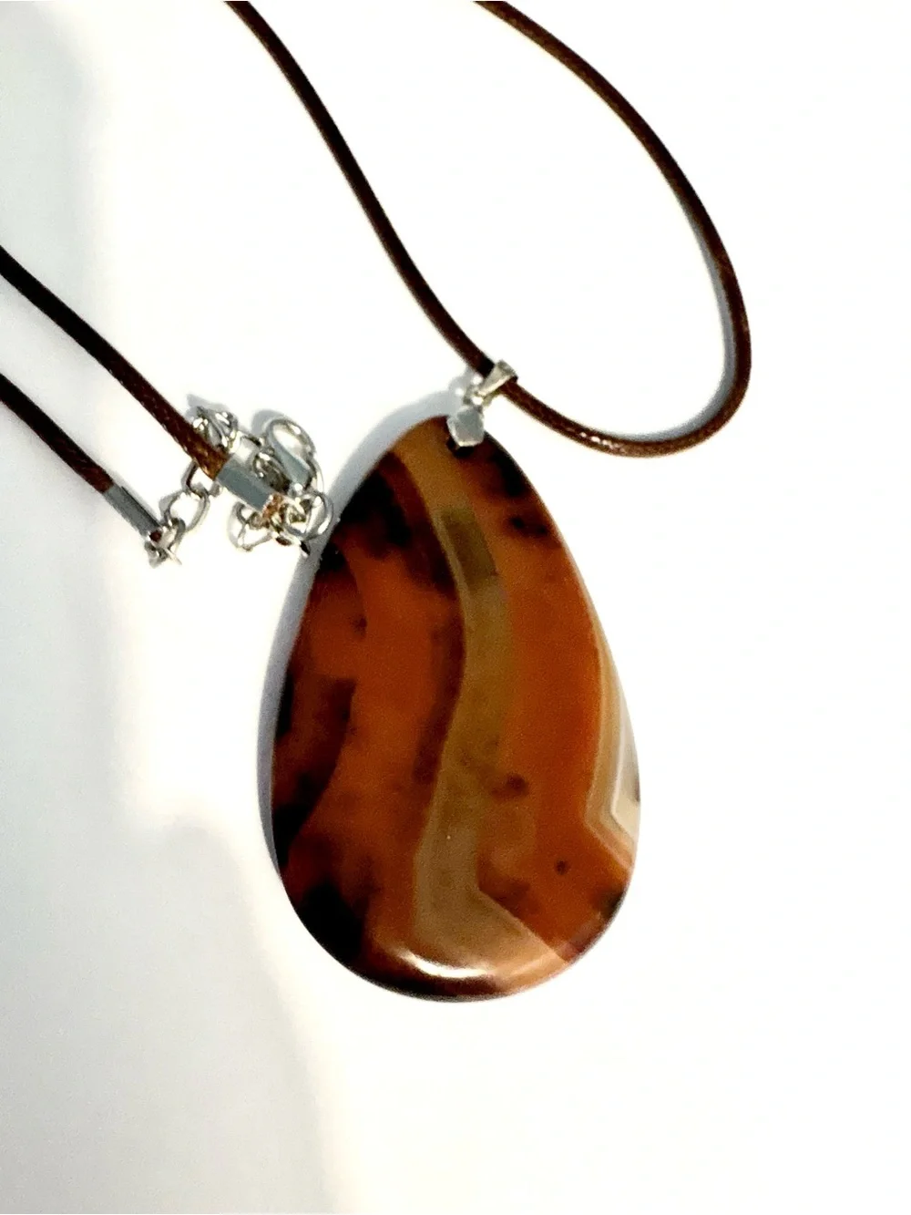 Beautiful, Geode Agate, pendant on a brown leather cord.